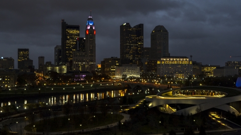 DXP001_088_0011 - Aerial stock photo of The city skyline's tall skyscrapers across the river at twilight, Downtown Columbus, Ohio
