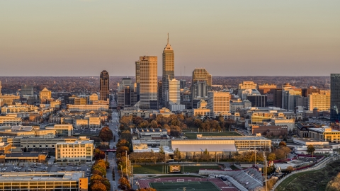 DXP001_092_0012 - Aerial stock photo of Wide view of the city's downtown skyline at sunset, Downtown Indianapolis, Indiana