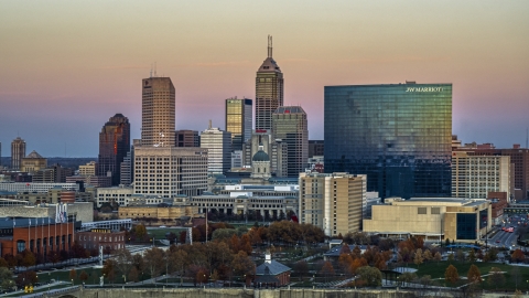 DXP001_092_0014 - Aerial stock photo of A hotel and view of the city's skyline at sunset, Downtown Indianapolis, Indiana