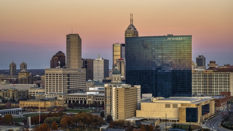 DXP001_092_0016 - Aerial stock photo of A hotel in front of the city's skyline at sunset, Downtown Indianapolis, Indiana