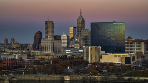DXP001_092_0021 - Aerial stock photo of The city's towering skyline and a hotel at sunset in Downtown Indianapolis, Indiana