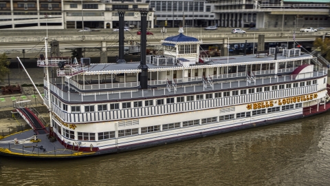 DXP001_095_0017 - Aerial stock photo of Close-up view of the historic riverboat docked by Downtown Louisville, Kentucky