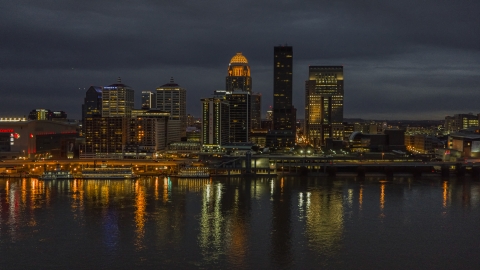 DXP001_096_0019 - Aerial stock photo of The Ohio River with a view of the city skyline at twilight, Downtown Louisville, Kentucky