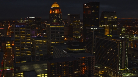 DXP001_096_0022 - Aerial stock photo of Tall buildings in the city's skyline lit up at twilight, Downtown Louisville, Kentucky