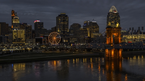DXP001_098_0012 - Aerial stock photo of Skyscraper and Ferris wheel at twilight, seen from the Ohio River, Downtown Cincinnati, Ohio