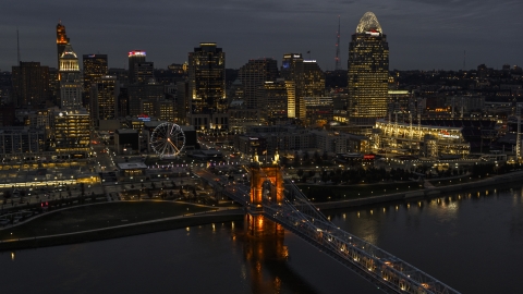 DXP001_098_0013 - Aerial stock photo of The city skyline at twilight, seen from river near bridge, Downtown Cincinnati, Ohio