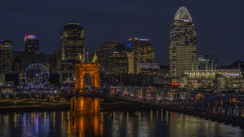 DXP001_098_0017 - Aerial stock photo of The Roebling Bridge at night and the city skyline, Downtown Cincinnati, Ohio