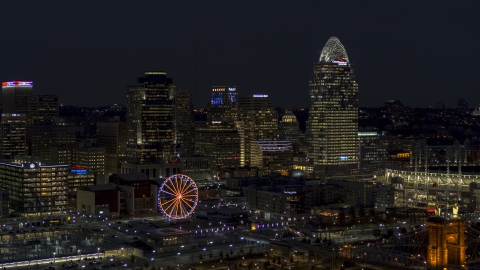 DXP001_098_0020 - Aerial stock photo of A view of the city skyline and Ferris wheel at night, Downtown Cincinnati, Ohio