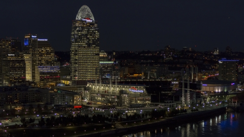 DXP001_098_0021 - Aerial stock photo of Tall skyscraper and the baseball stadium at night, Downtown Cincinnati, Ohio