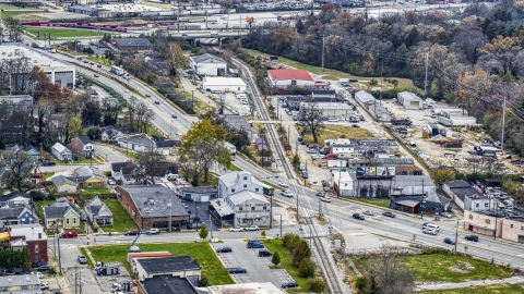 DXP001_099_0010 - Aerial stock photo of A busy street and railroad tracks in industrial area in Lexington, Kentucky