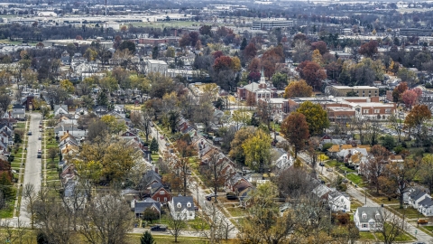 DXP001_099_0015 - Aerial stock photo of A church steeple and a tree-lined suburban neighborhood in Lexington, Kentucky