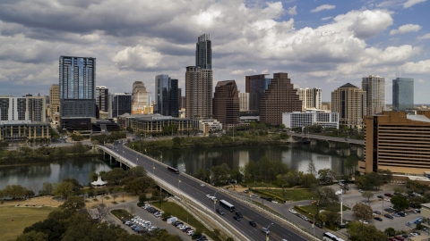 DXP002_102_0001 - Aerial stock photo of The city's skyline seen from First Street Bridge and Lady Bird Lake, Downtown Austin, Texas