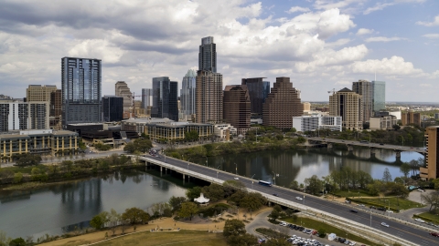 DXP002_102_0004 - Aerial stock photo of The First Street Bridge, Lady Bird Lake and skyline of Downtown Austin, Texas