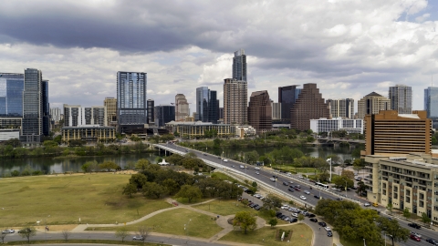 DXP002_102_0006 - Aerial stock photo of The city's skyline seen from First Street Bridge and Lady Bird Lake, Downtown Austin, Texas
