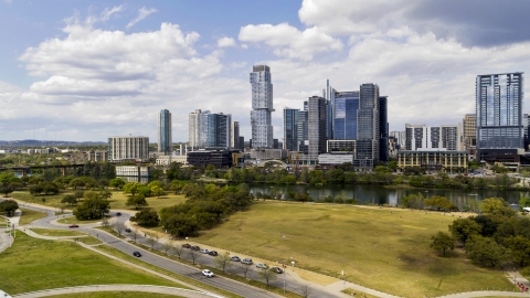 DXP002_102_0015 - Aerial stock photo of A view of city skyline across Lady Bird Lake in Downtown Austin, Texas