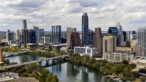 DXP002_102_0020 - Aerial stock photo of The city skyline beside bridges and Lady Bird Lake, Downtown Austin, Texas