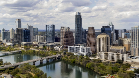DXP002_102_0021 - Aerial stock photo of Tall skyscrapers in the city skyline by bridges and Lady Bird Lake, Downtown Austin, Texas