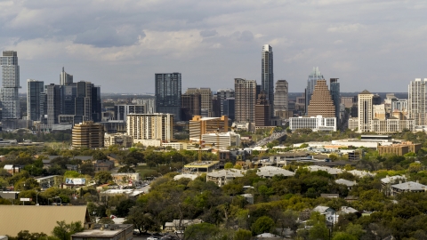 DXP002_103_0013 - Aerial stock photo of The city's skyline on a cloudy day, Downtown Austin, Texas