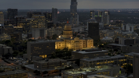 DXP002_105_0023 - Aerial stock photo of The state capitol building at twilight in Downtown Austin, Texas
