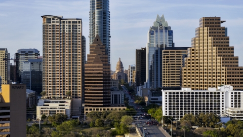 DXP002_109_0017 - Aerial stock photo of The state capitol building seen between skyscrapers in Downtown Austin, Texas