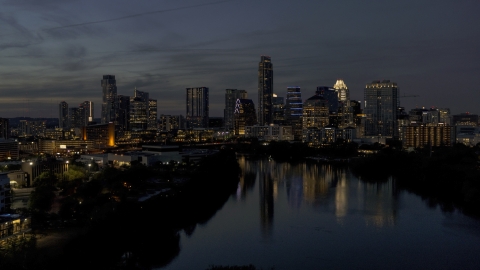DXP002_111_0001 - Aerial stock photo of A view of Lady Bird Lake, focus on the waterfront skyline at twilight in Downtown Austin, Texas