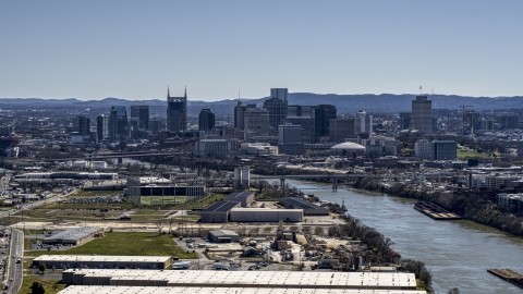 DXP002_112_0006 - Aerial stock photo of The city's skyline by the Cumberland River in Downtown Nashville, Tennessee
