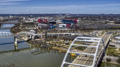 DXP002_116_0008 - Aerial stock photo of Nissan Stadium seen from a bridge in Nashville, Tennessee