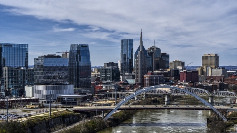 DXP002_116_0010 - Aerial stock photo of Office high-rise and skyscrapers seen from river and bridge in Downtown Nashville, Tennessee