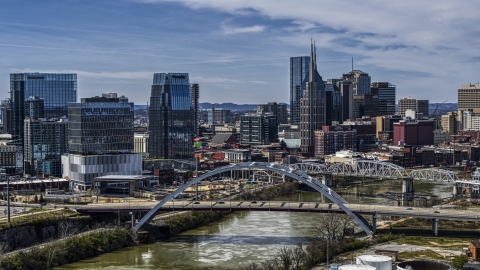 DXP002_116_0012 - Aerial stock photo of A bridge, and skyscrapers near the Cumberland River in Downtown Nashville, Tennessee