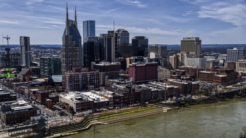 DXP002_117_0004 - Aerial stock photo of The city's skyline overlooking the Cumberland River, Downtown Nashville, Tennessee