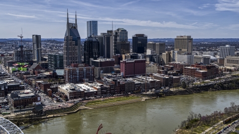 DXP002_117_0005 - Aerial stock photo of The city's skyline overlooking the Cumberland River, Downtown Nashville, Tennessee