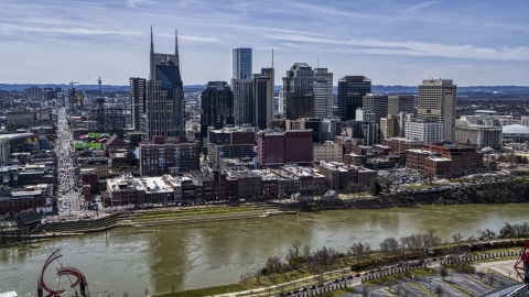DXP002_117_0006 - Aerial stock photo of A view of city's skyline across the Cumberland River, Downtown Nashville, Tennessee