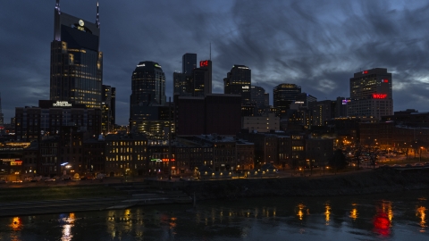 DXP002_121_0001 - Aerial stock photo of The city's skyline at twilight seen from the river, Downtown Nashville, Tennessee
