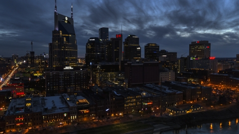 DXP002_121_0002 - Aerial stock photo of Clouds above the city's skyline at twilight, Downtown Nashville, Tennessee