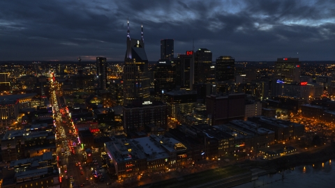 DXP002_121_0005 - Aerial stock photo of The AT&T Building skyscraper and city skyline at twilight, Downtown Nashville, Tennessee