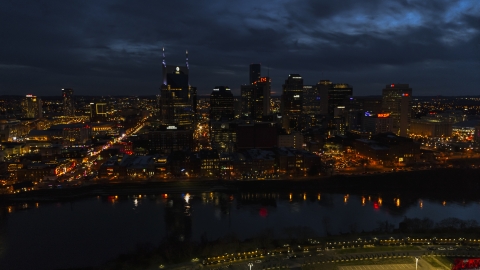 DXP002_121_0009 - Aerial stock photo of Tthe AT&T Building and skyline at twilight on the other side of the river, Downtown Nashville, Tennessee