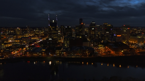 DXP002_121_0010 - Aerial stock photo of The city skyline and the AT&T Building across the river at twilight, Downtown Nashville, Tennessee