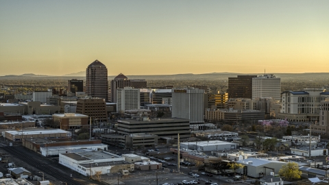DXP002_122_0007 - Aerial stock photo of High-rise office buildings at sunset in Downtown Albuquerque, New Mexico