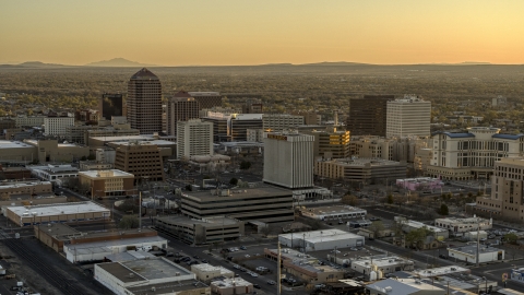 DXP002_122_0008 - Aerial stock photo of A view of high-rise office buildings at sunset, Downtown Albuquerque, New Mexico