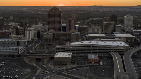 DXP002_122_0011 - Aerial stock photo of Office tower and shorter hotel tower behind convention center at sunset, Downtown Albuquerque, New Mexico