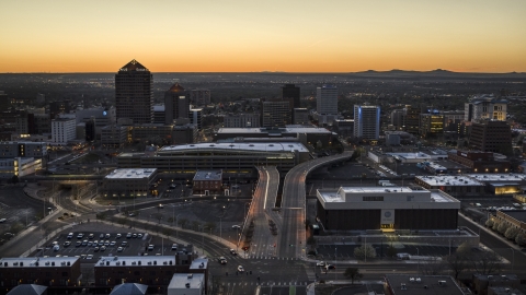 DXP002_123_0005 - Aerial stock photo of A view of Albuquerque Plaza, Hyatt Regency and city high-rises at sunset, Downtown Albuquerque, New Mexico