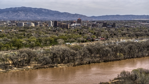 DXP002_124_0002 - Aerial stock photo of High-rise office buildings seen from the Rio Grande, Downtown Albuquerque, New Mexico