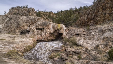 DXP002_129_0002 - Aerial stock photo of A view of rapids flowing through a rock formation in the mountains of New Mexico