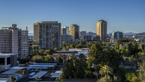 DXP002_138_0009 - Aerial stock photo of High-rise apartment buildings near tall office buildings in Phoenix, Arizona