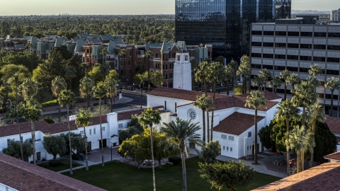 DXP002_138_0010 - Aerial stock photo of Palm trees and a church steeple in Phoenix, Arizona