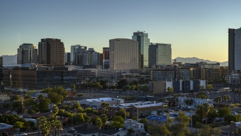 DXP002_138_0011 - Aerial stock photo of A hotel and high-rise office buildings at sunset in Downtown Phoenix, Arizona