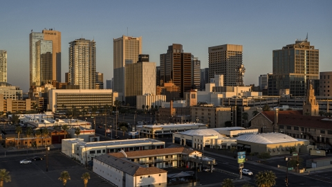 DXP002_143_0007 - Aerial stock photo of The city's tall skyline at sunset, Downtown Phoenix, Arizona