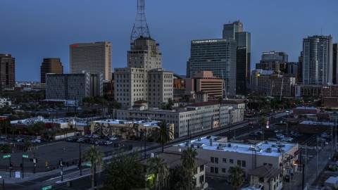 DXP002_143_0010 - Aerial stock photo of Westward Ho building and office towers at twilight, Downtown Phoenix, Arizona