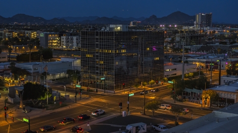 DXP002_143_0012 - Aerial stock photo of A glass office building at twilight, Downtown Phoenix, Arizona