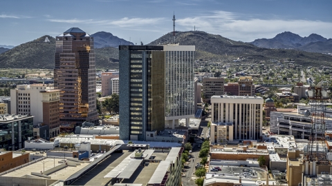 DXP002_144_0005 - Aerial stock photo of Three office towers with Sentinel Peak behind them, Downtown Tucson, Arizona